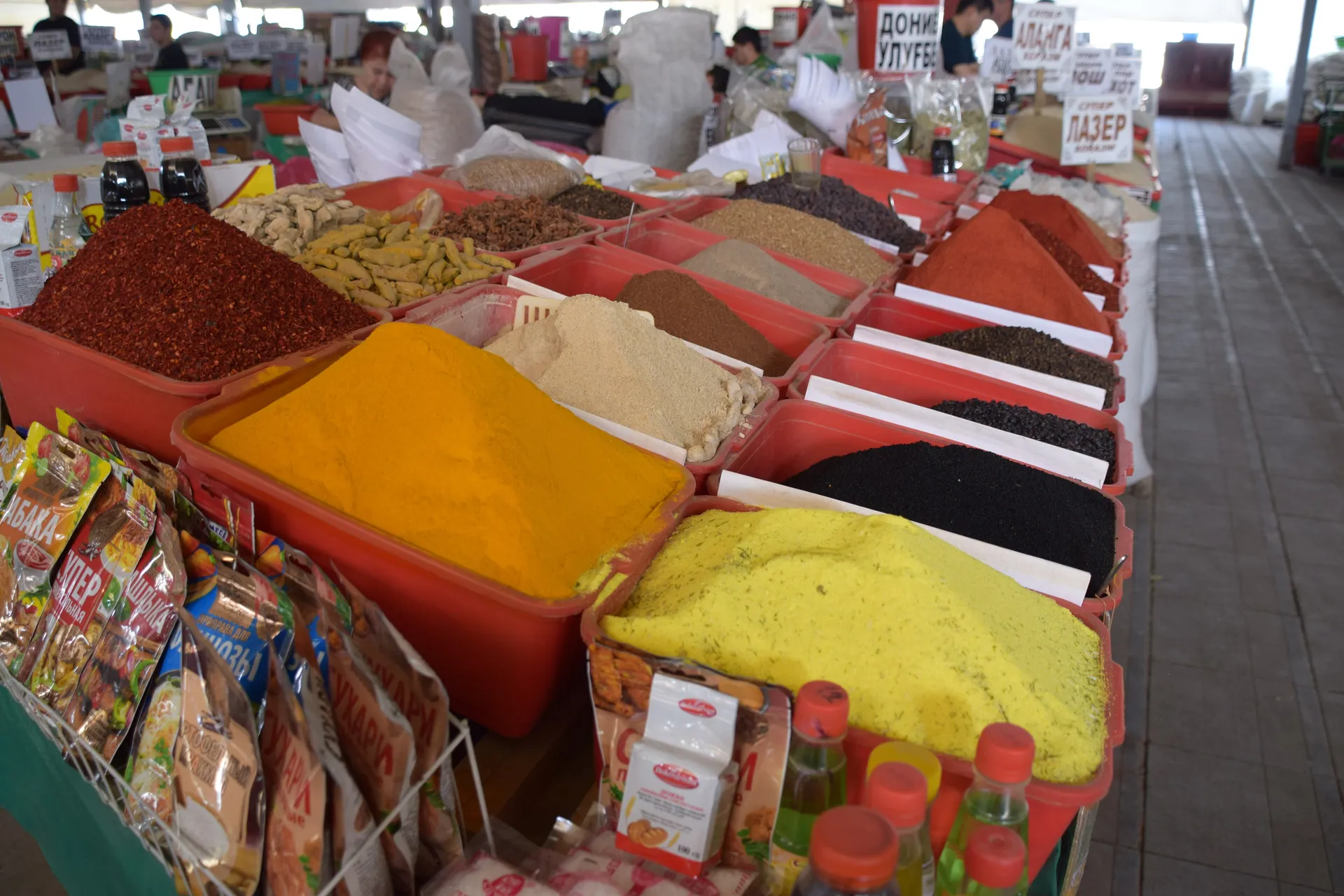 Cumin, red pepper, turmeric and plov spice mixes piled high at Chorsu Bazaar — zira, black cumin, is the one plov cannot do without.